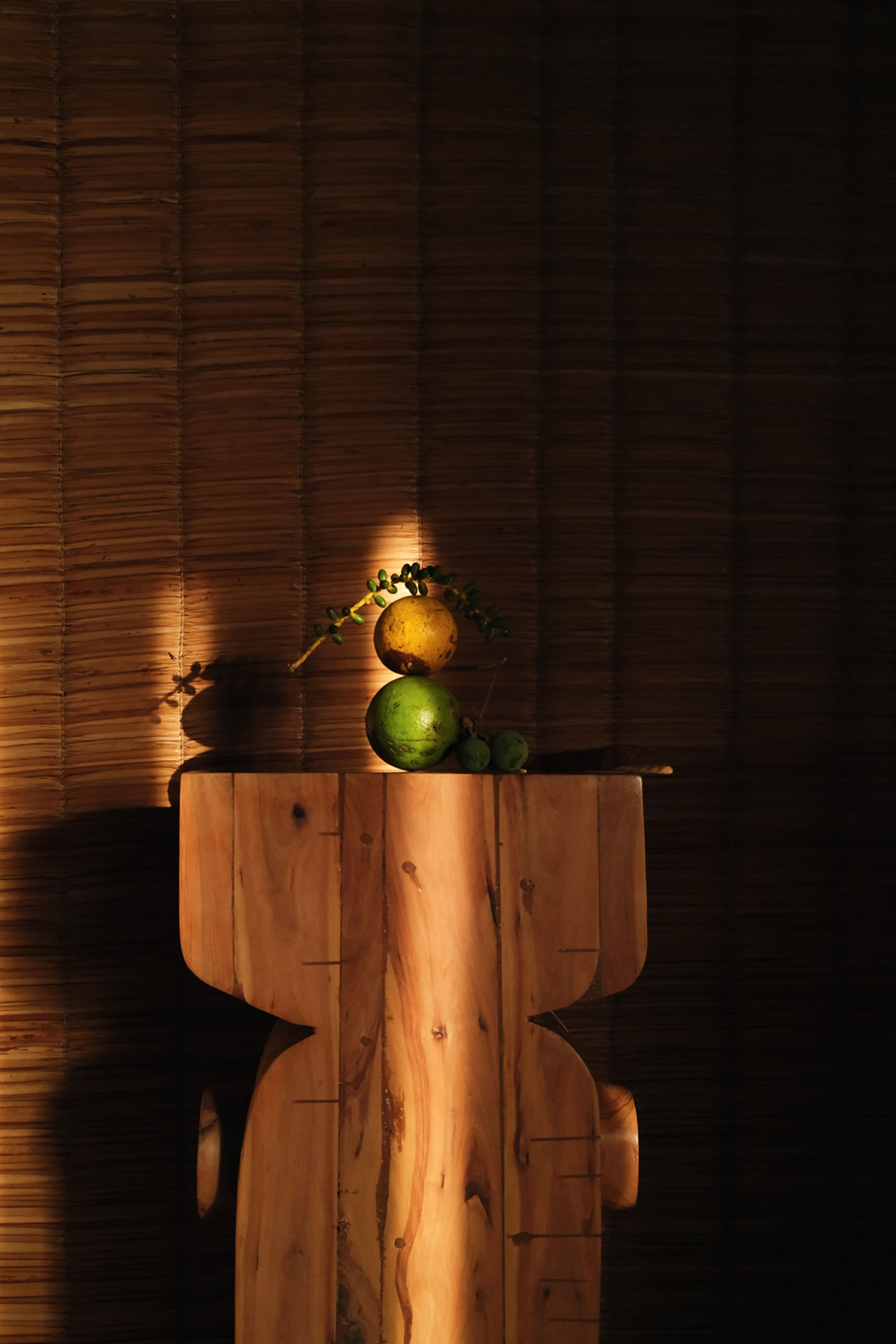 Fruits displayed on wooden sculpture