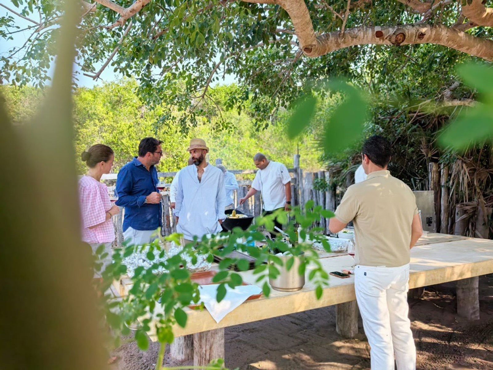 Guests in Kisawa's garden with table setup